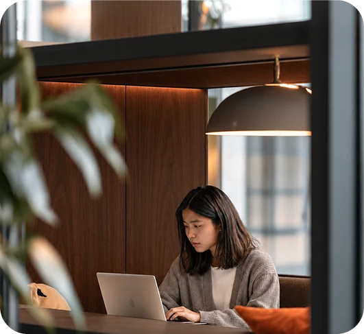 Revenue operator reviewing forecasts on a laptop